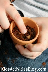 child planting seed