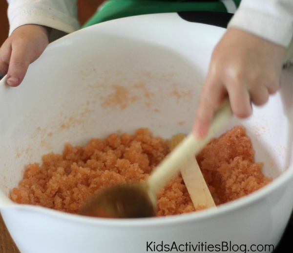 child mixing in bowl