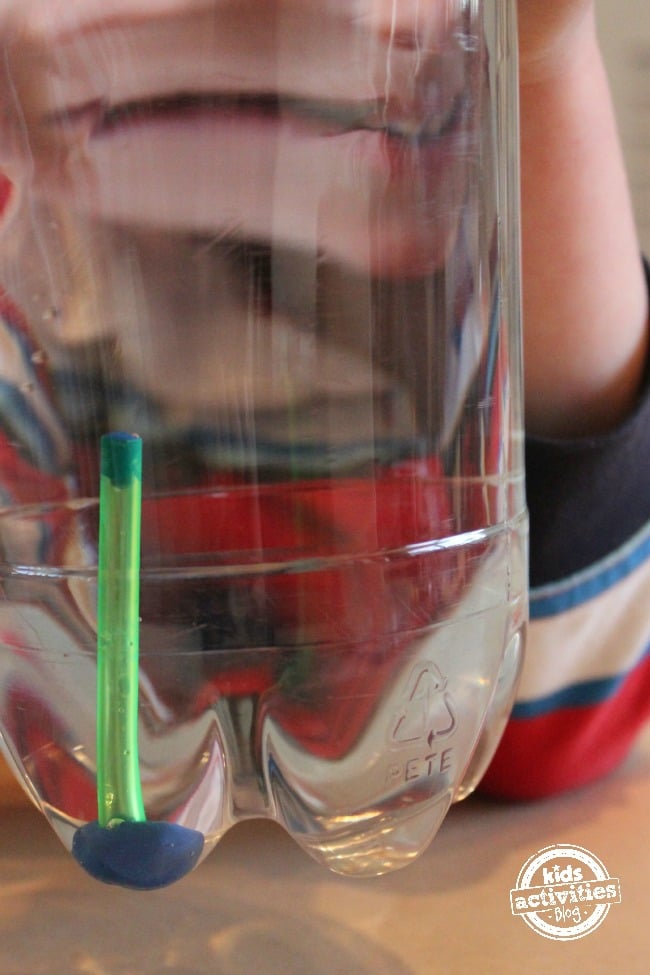 Demonstrating air pressure with water bottle