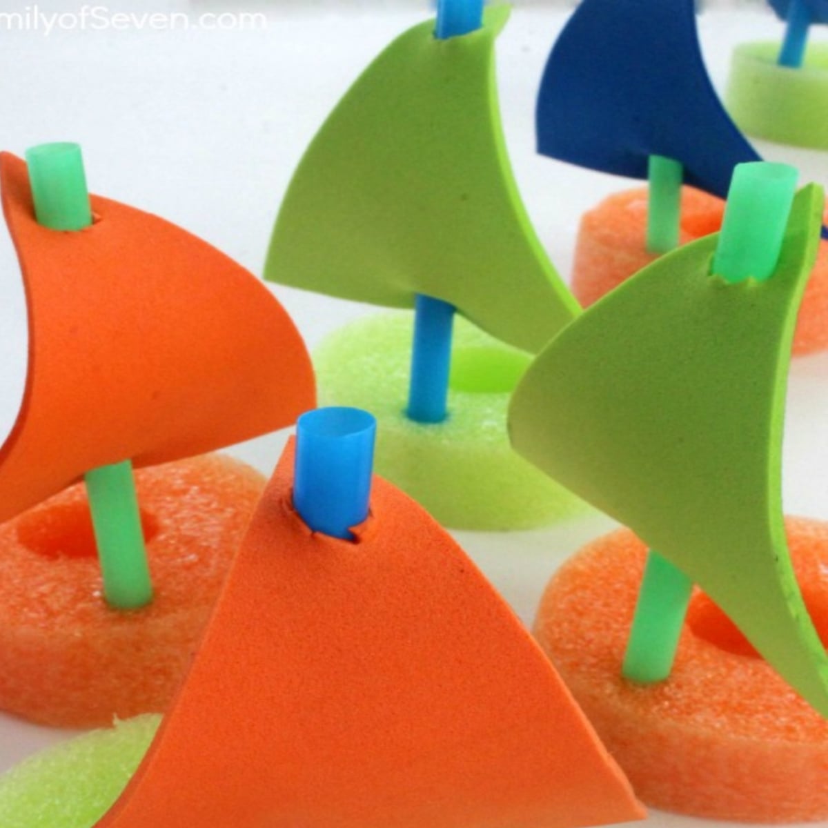 Pool Noodle Activities- orange and green boats with straws- Kids Activities Blog