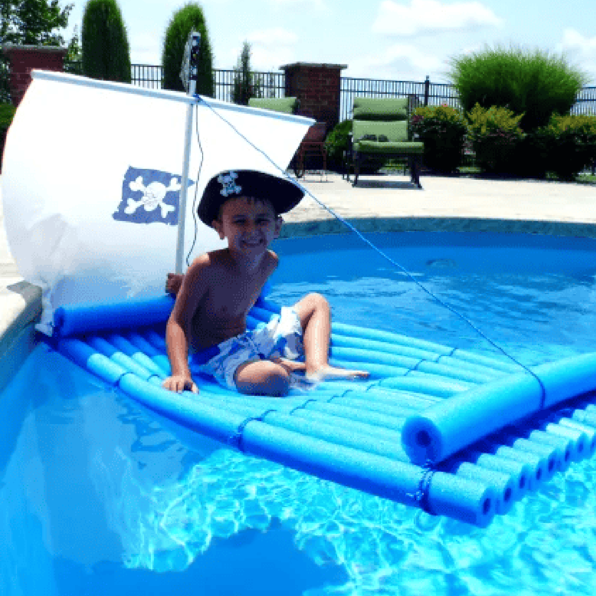 Pool Noodle Activities- pirate raft with flag and child in hat- Kids Activities Blog