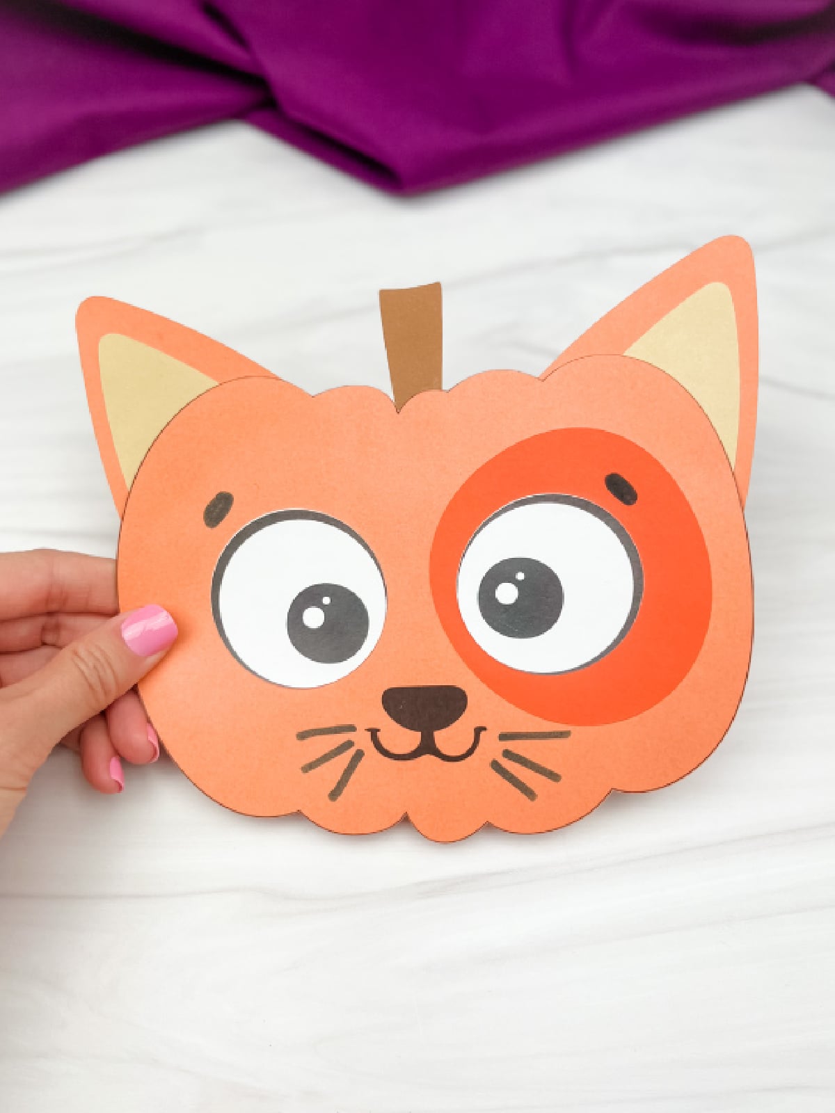 Pumpkin Activities- Cat that is made to look like a pumpkin with paper- Kids Activities Blog