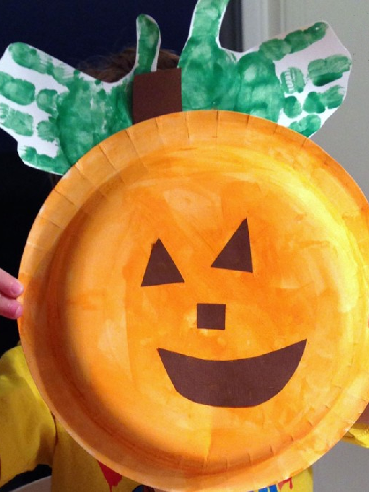 Pumpkin Activities- Paper plate pumpkin with handprint leaves- Kids Activities Blog