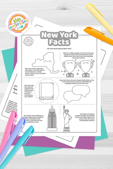 Black and white coloring pages with facts about New York lying on top of a blue-green sheet with multicolored letters on a gray background.