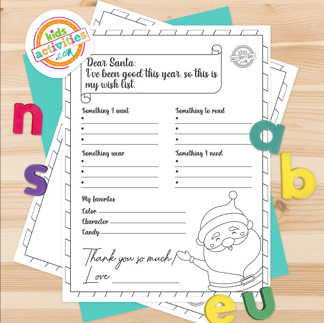 Stack of printed Santa Wish list printables on top of green and purple pages, with markers next to them, on top of a gray background.