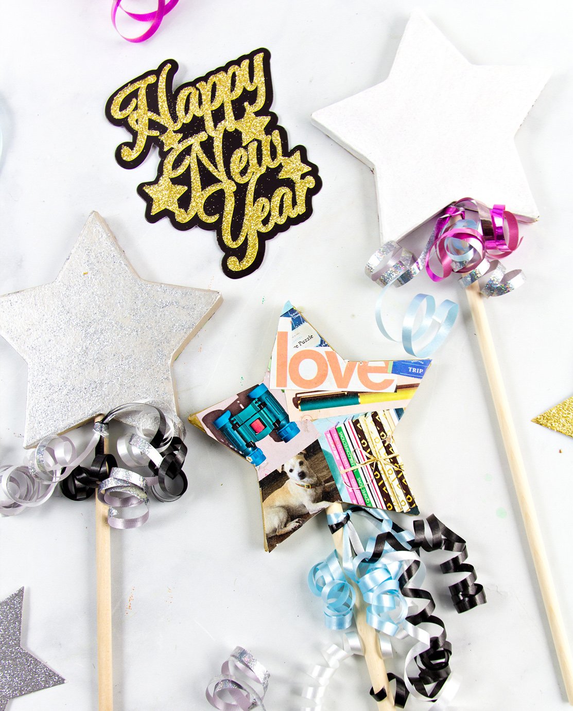 Different wishing wand crafts made for new year, with the text Happy New Year.