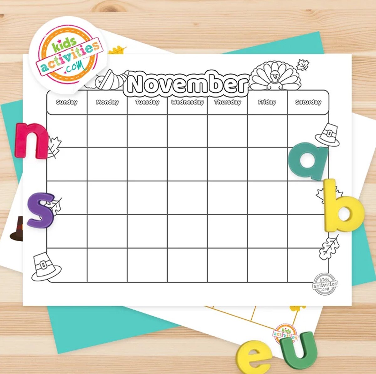 Printed November calendar next to magnetic letters.