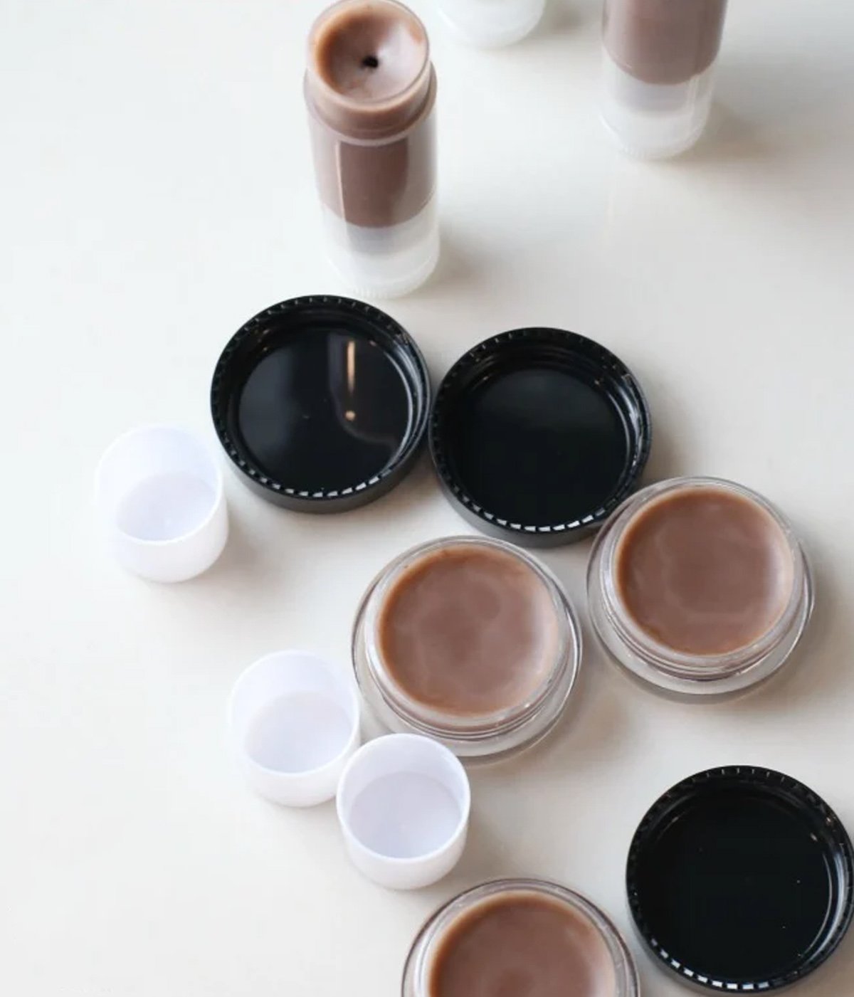Ingredients needed to make a chocolate lip balm at home.