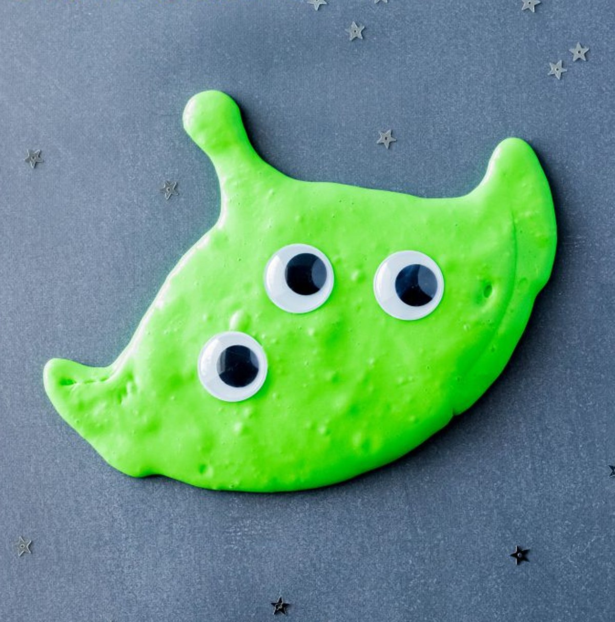 A Toy Story alien-inspired slime, with googly eyes.
