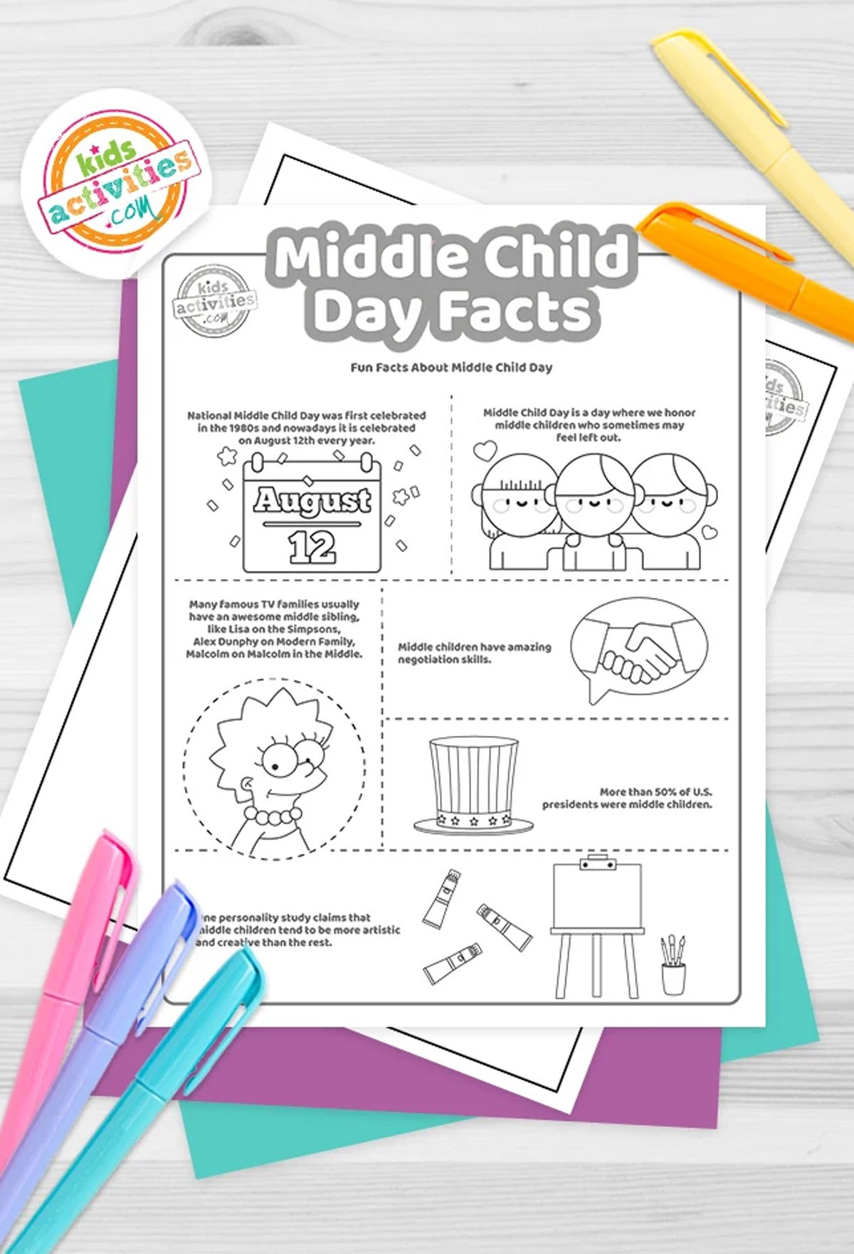 Black and white Middle Child Day Facts printable on top of blue and purple sheets and with markers next to them, on top of a gray background.