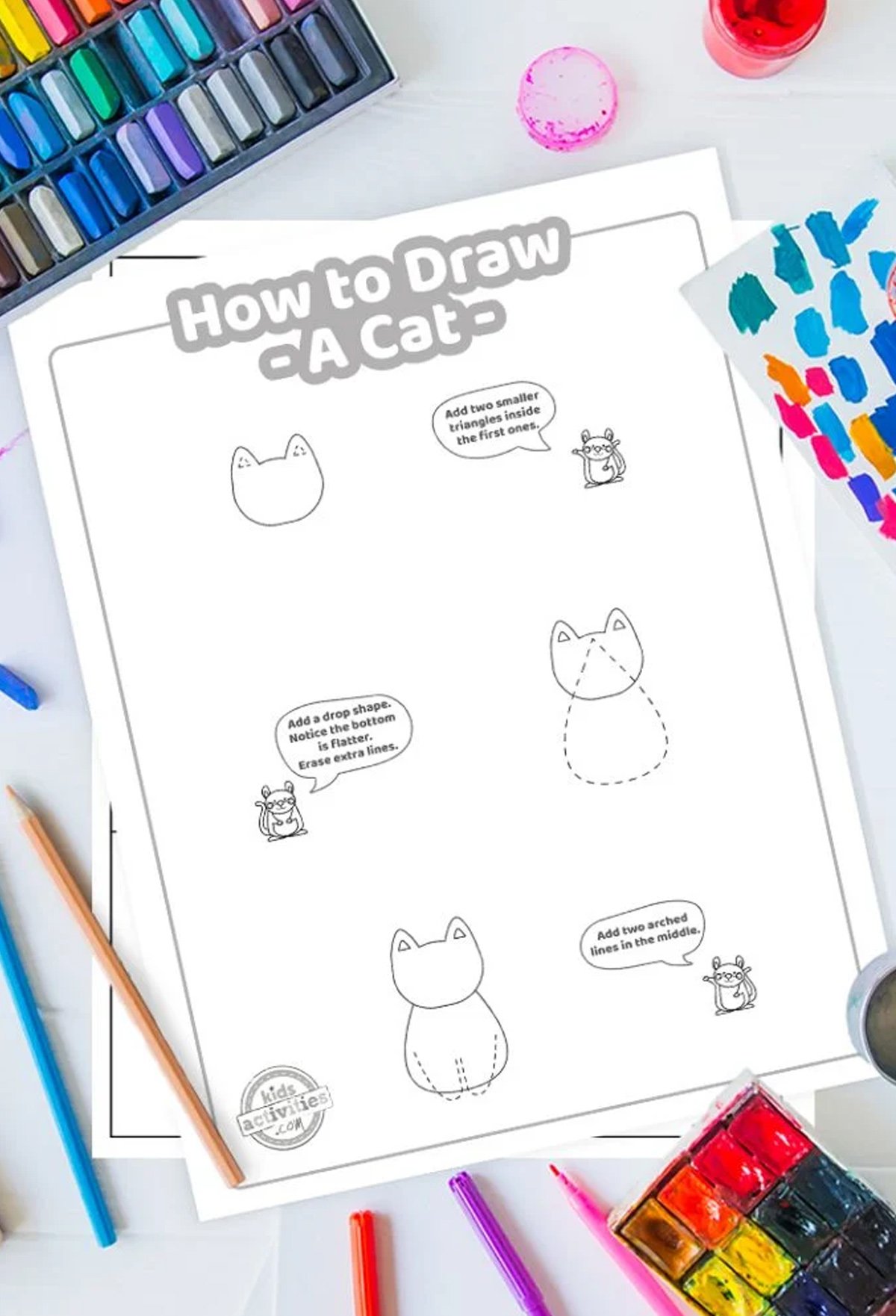 Black and white printable how to draw a cat tutorial on top of blue and purple sheets and with markers next to them.