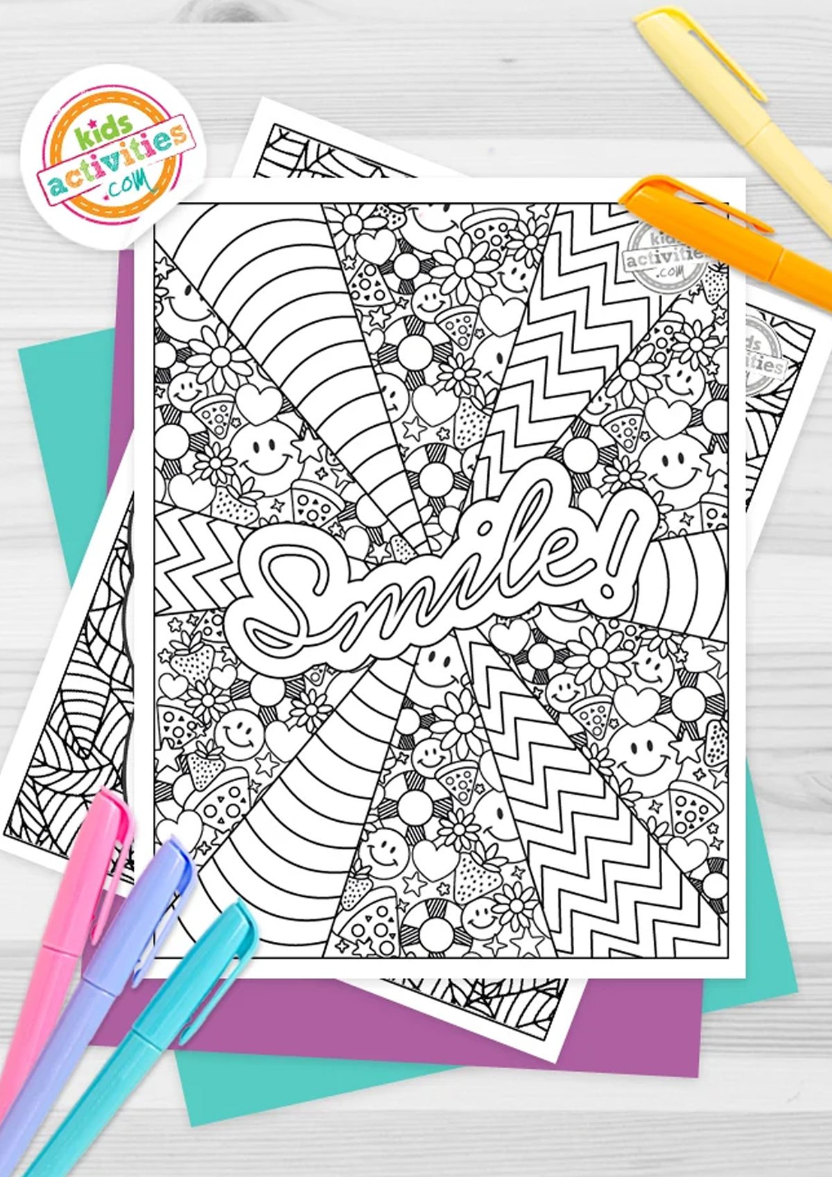 Black and white printable hard coloring pages, with different patterns and designs and thew ord Smile! written on the first one, on top of blue and purple sheets and with markers next to them.