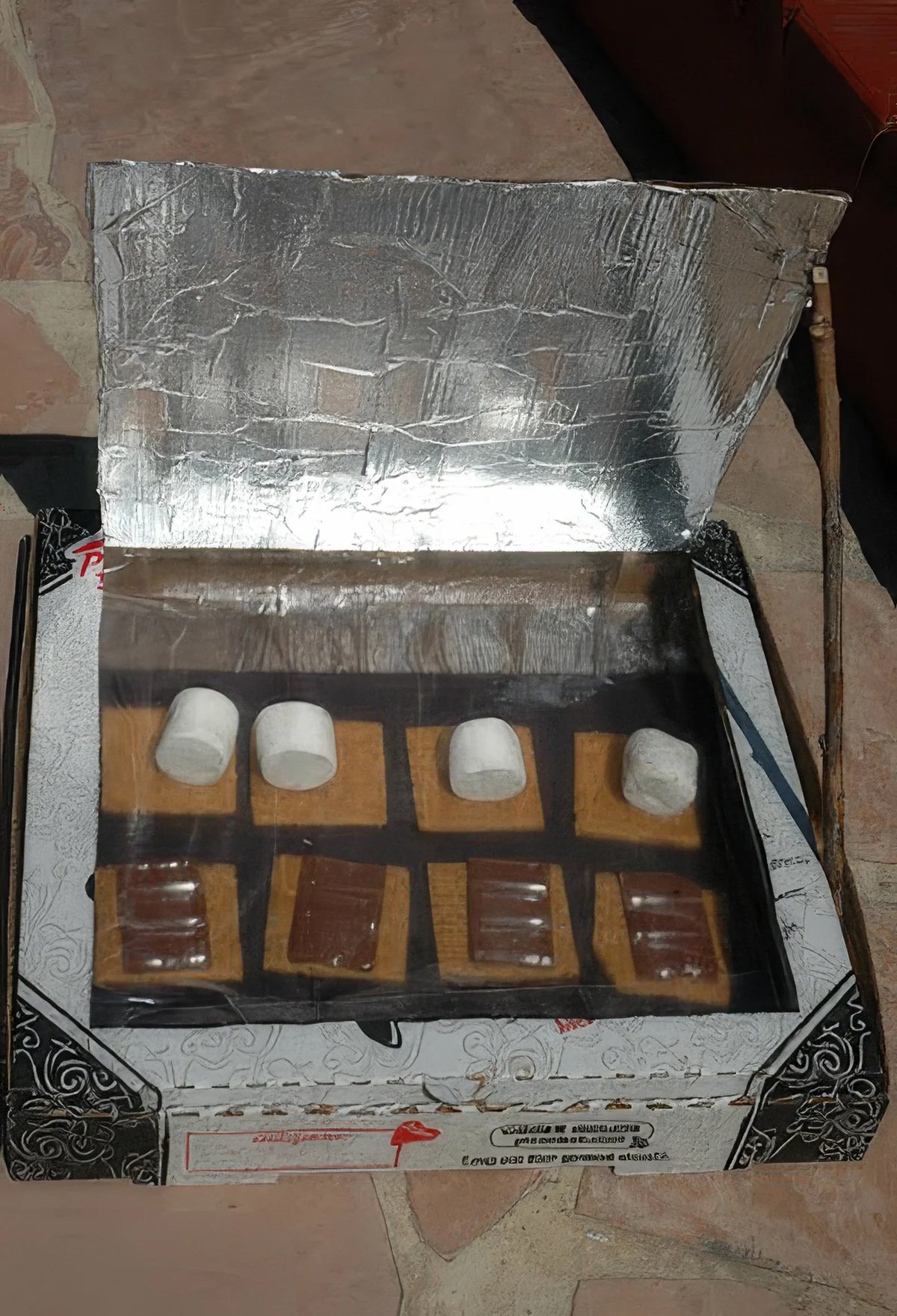A setup to make solar smores: smores done with help of the sun.