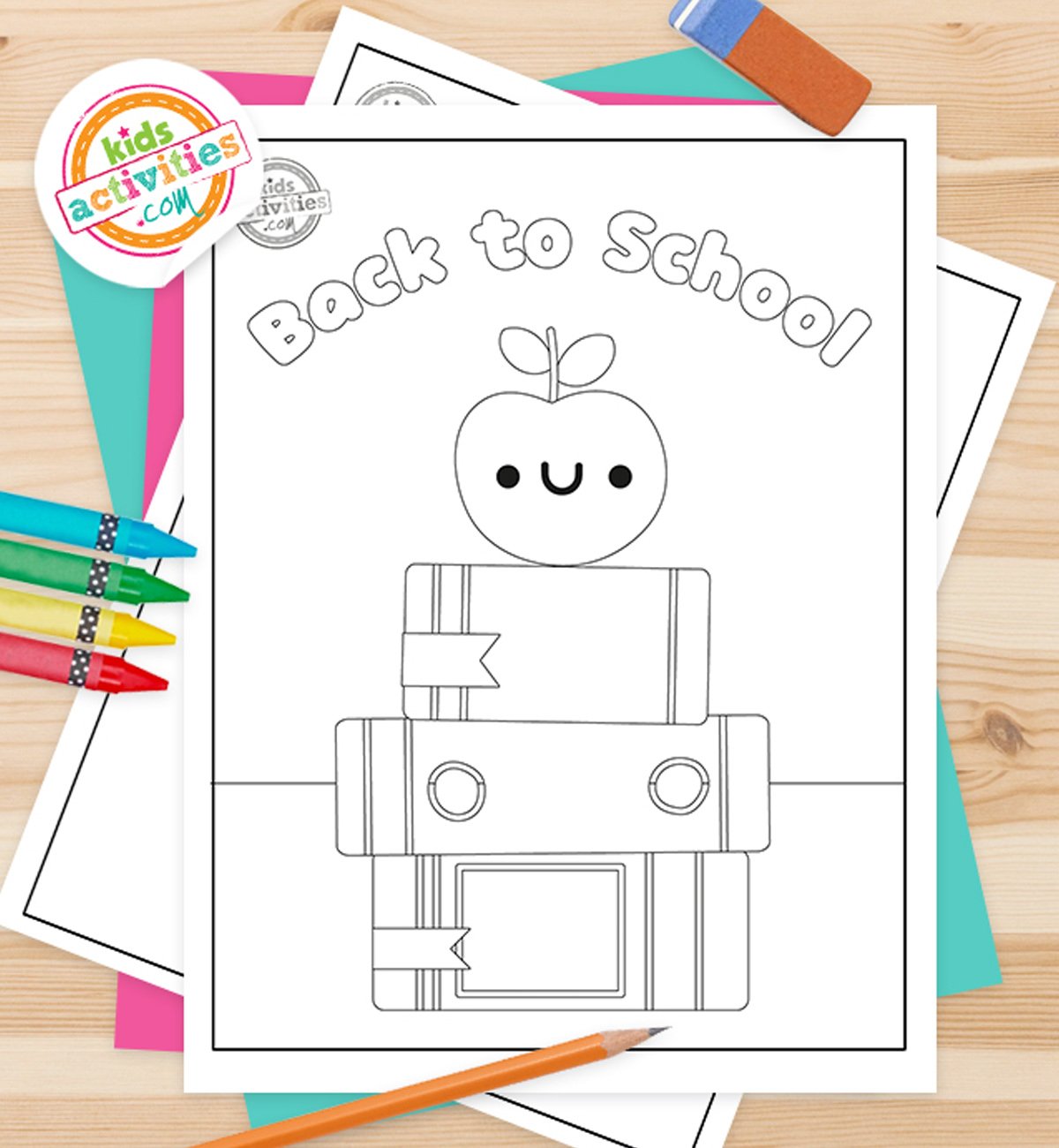 Black and white Back to school themed coloring pages on top of green and pink sheets, with crayons next to it.