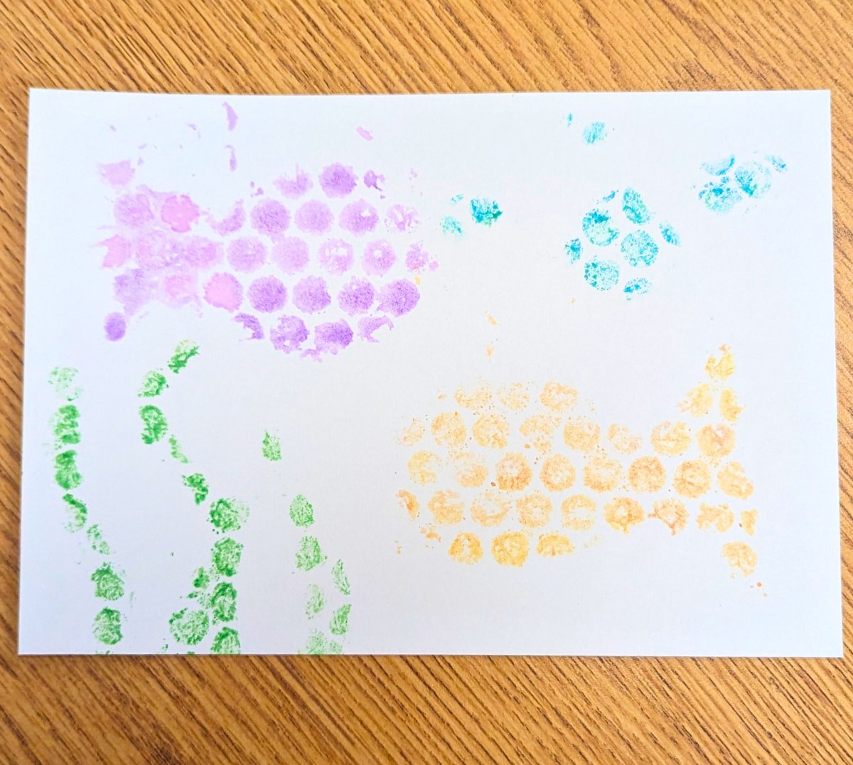 A kid's painting with a sea theme, made with a bubble wrap watercolor painting technique.