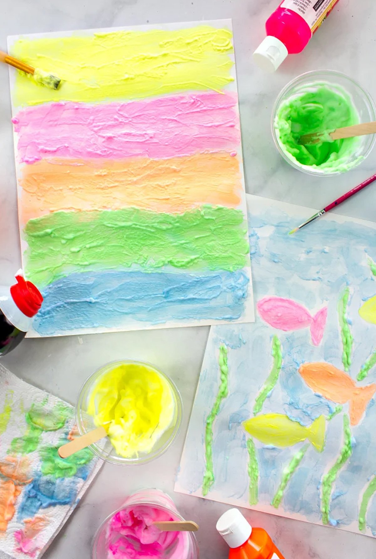 Two finished paintings made with homemade shaving cream paint.