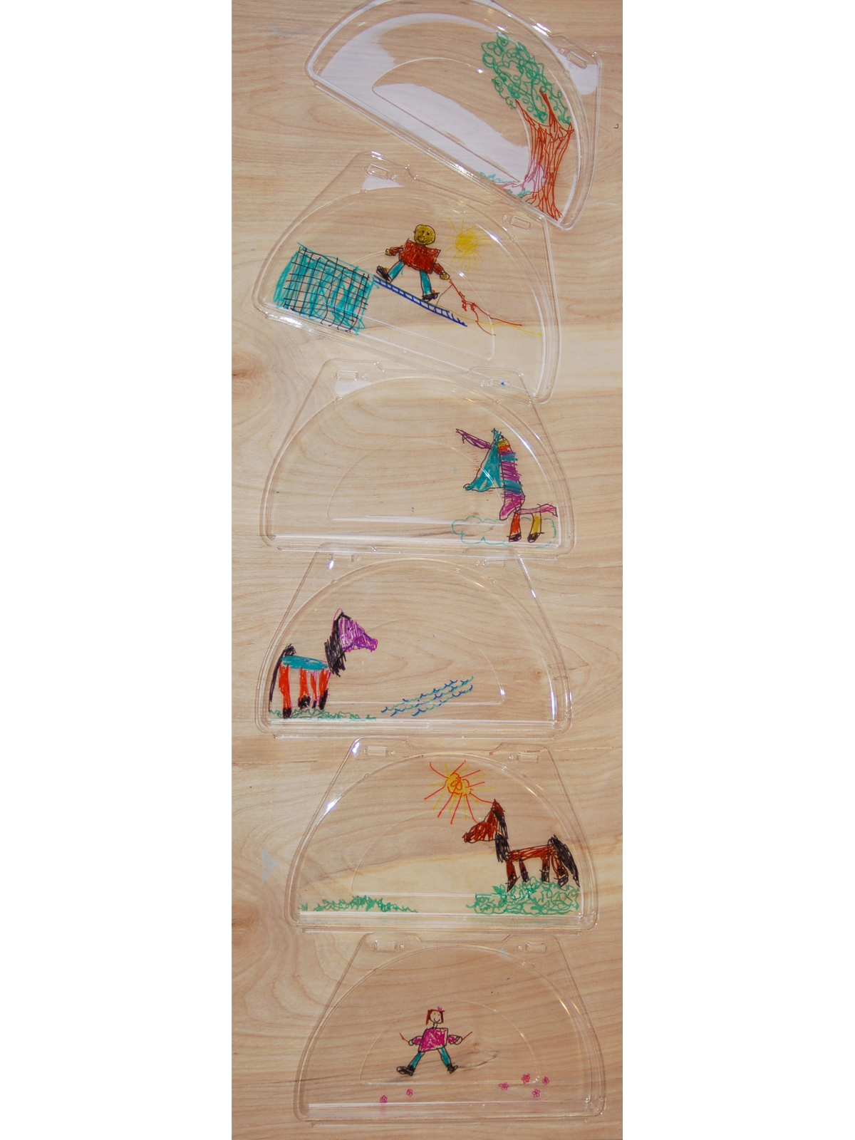 Layered Art Notes: Plan out your story, 5 plastic lids and plates with pictures- kids activities blog