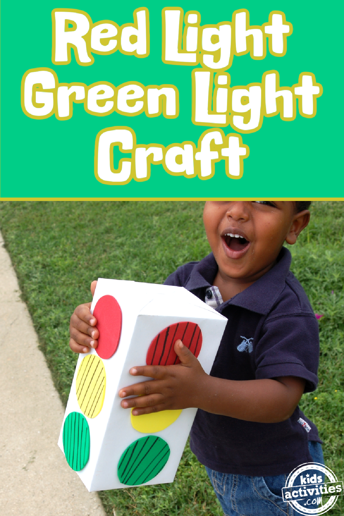 red light green light- little boy holding a light signal box- kids activities blog