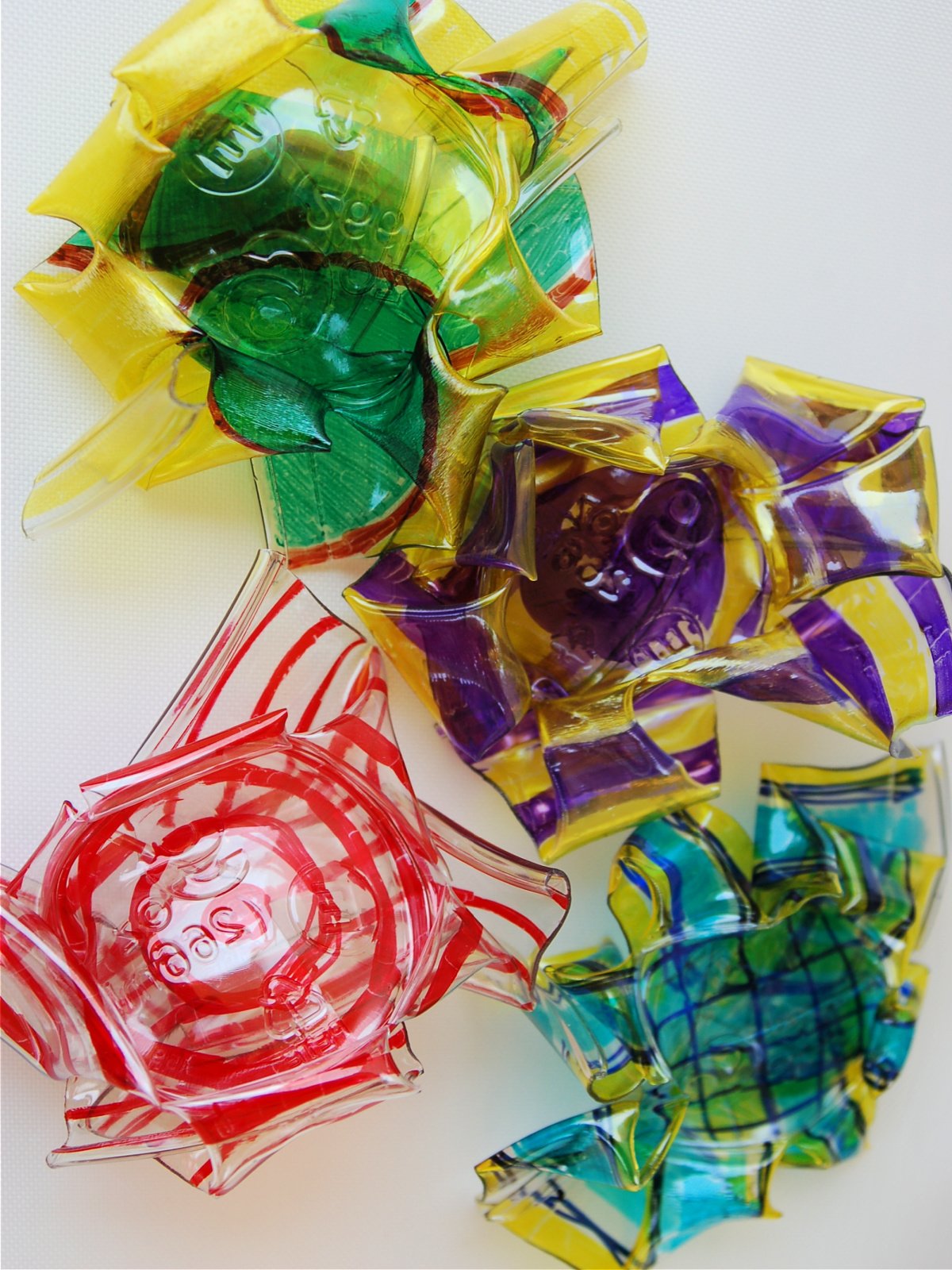 Shrinking Plastic Craft- completed- red, white, purple, yellow, green, blue flowers- kids activities blog