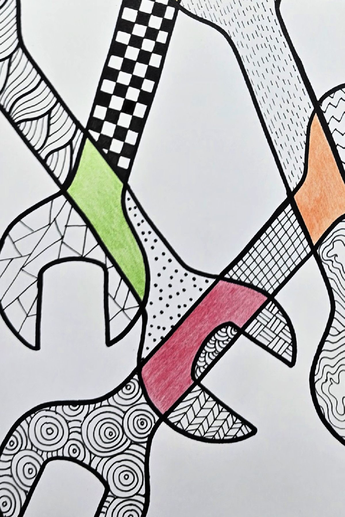 step 5 - overlapping wrench design using both colored pencil and permanent markers for zentangle art - kids activities blog