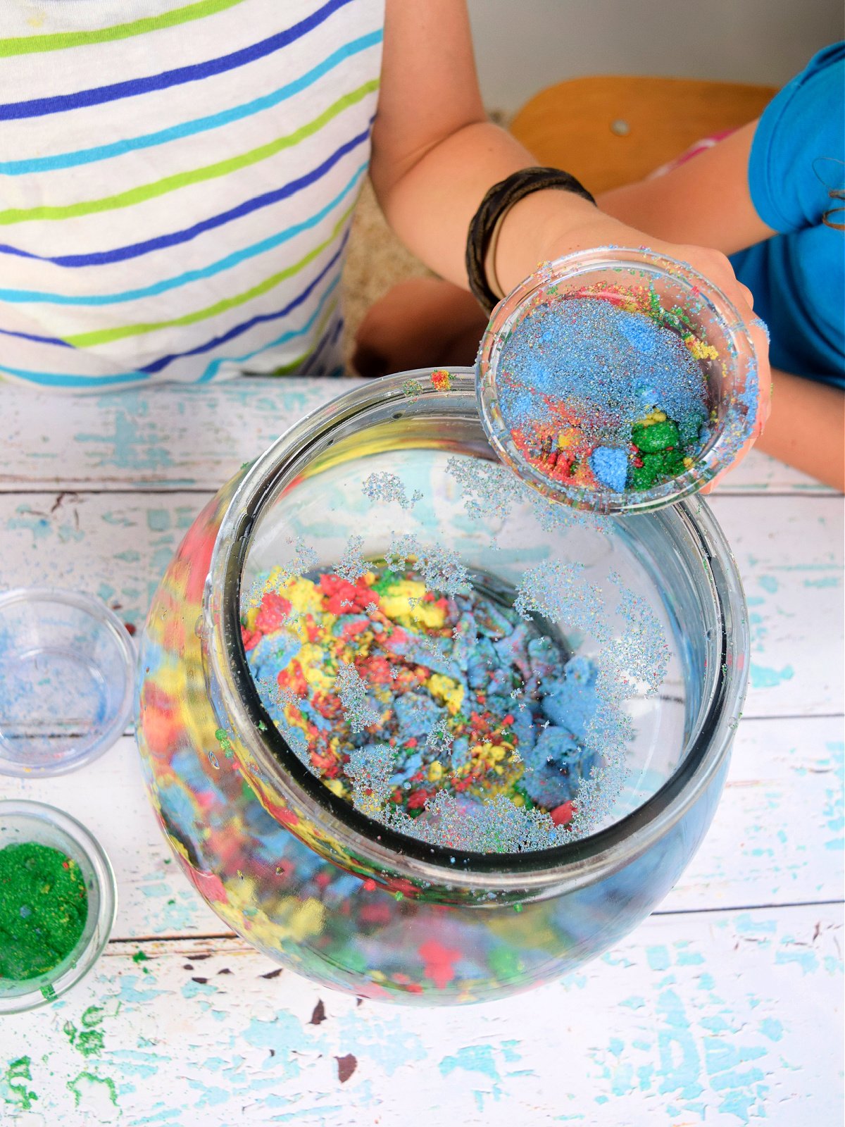 Aqua Sand- Finished- red, green, yellow, blue sand in a fish bowl- kids activities blog