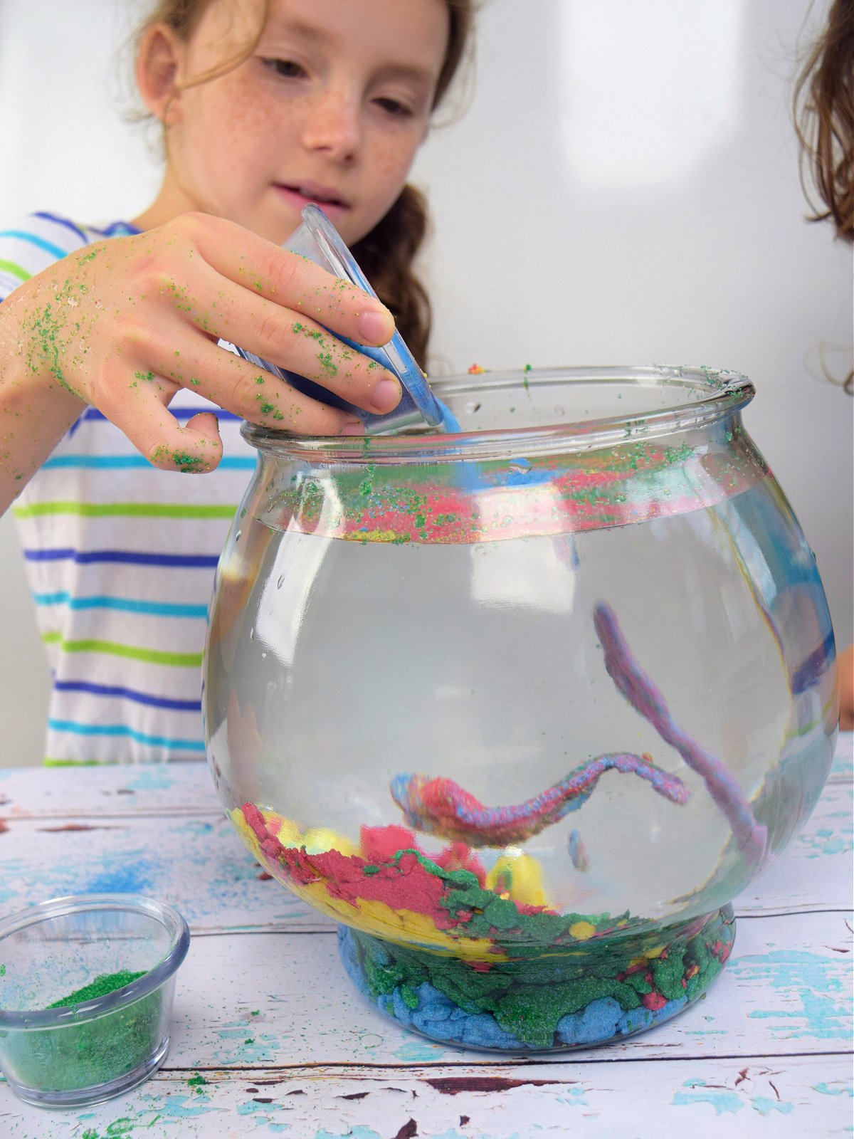 Aqua Sand- Step 4- Pour sand into water- kids activities blog