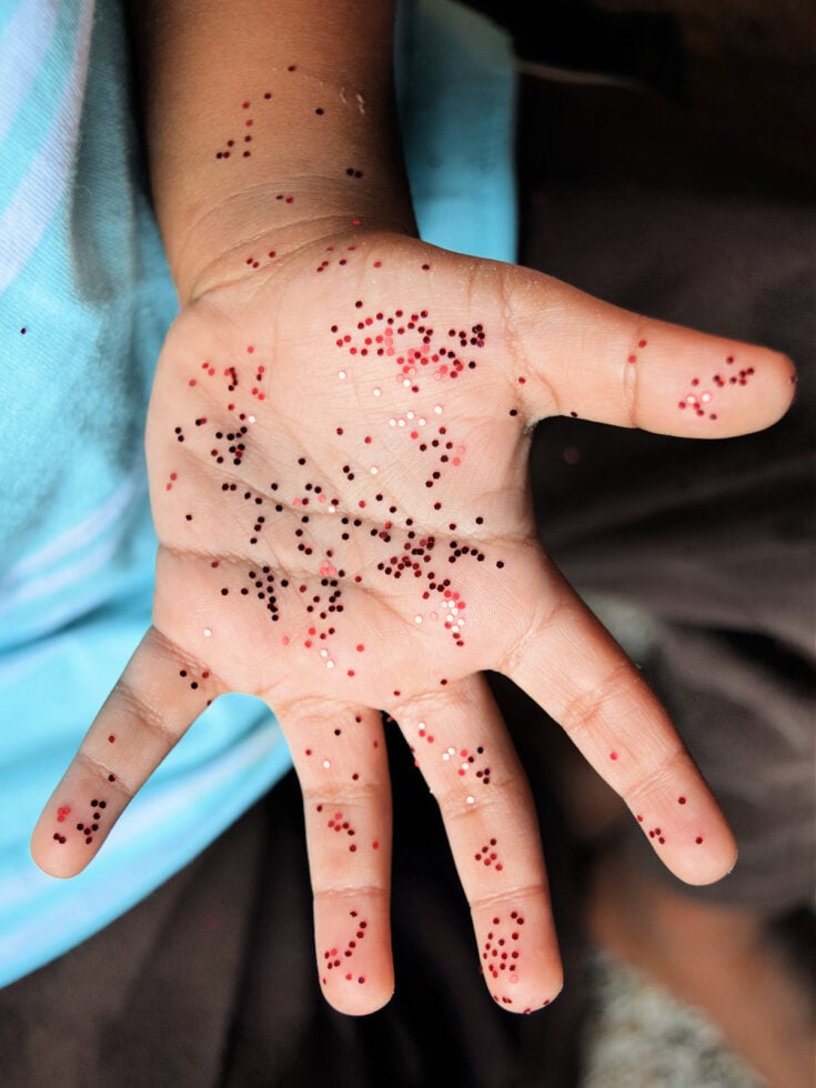 Spreading Germs- Step 1- Hands open with glitter on them- kids activities blog