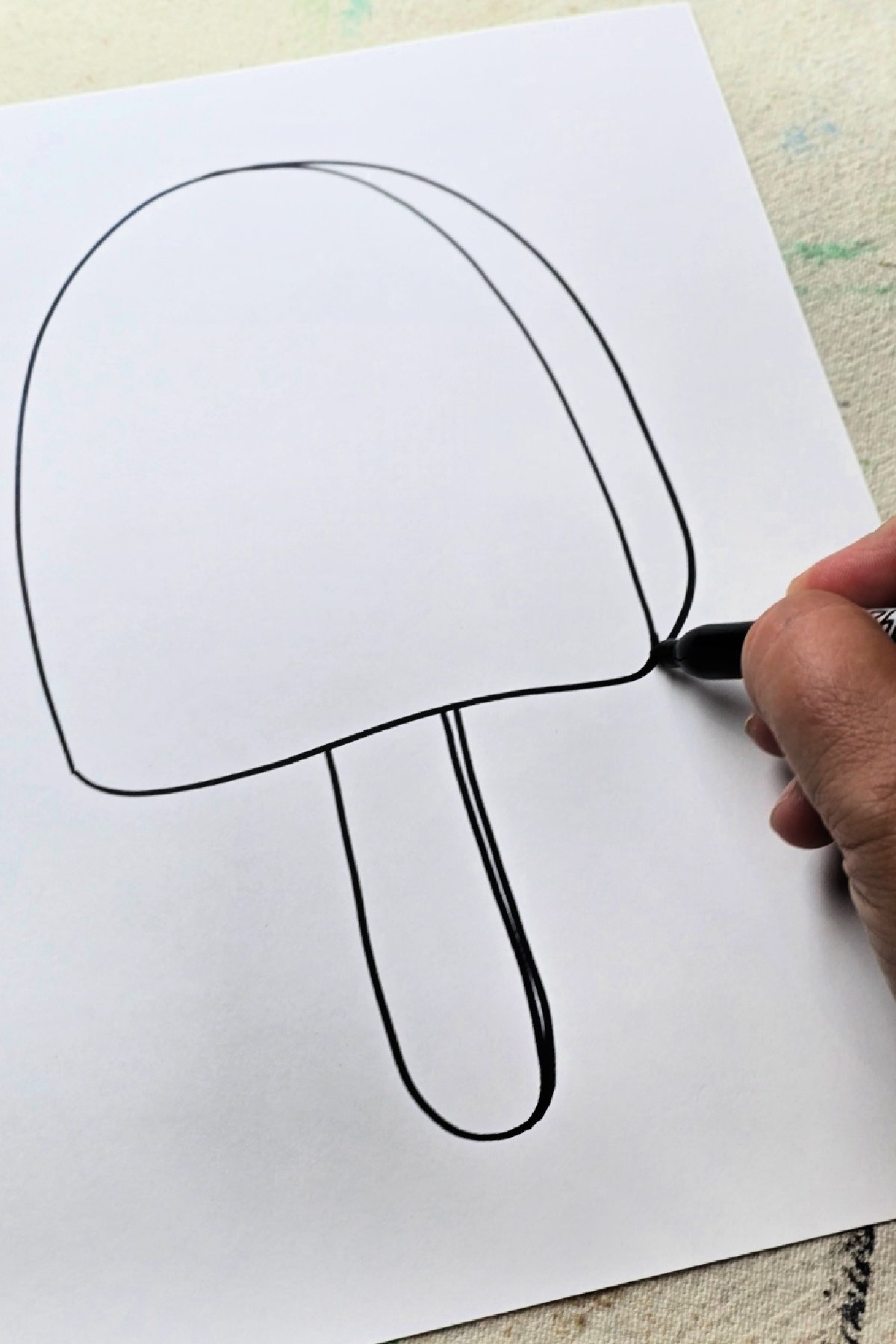 step 1 - using a permanent marker to draw the outline of a popsicle - kids activities blog