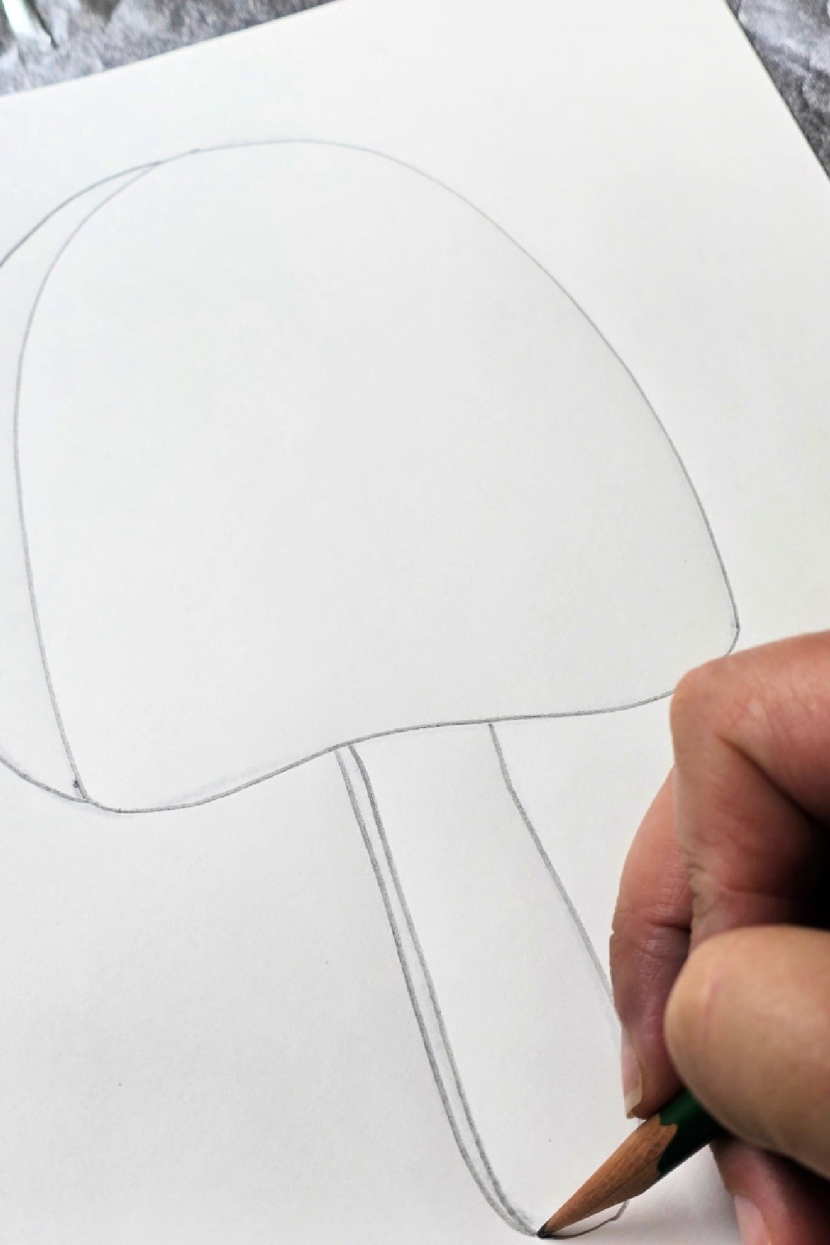 step 2 - tracing design with a dull pencil to transfer it to aluminum foil - kids activities blog