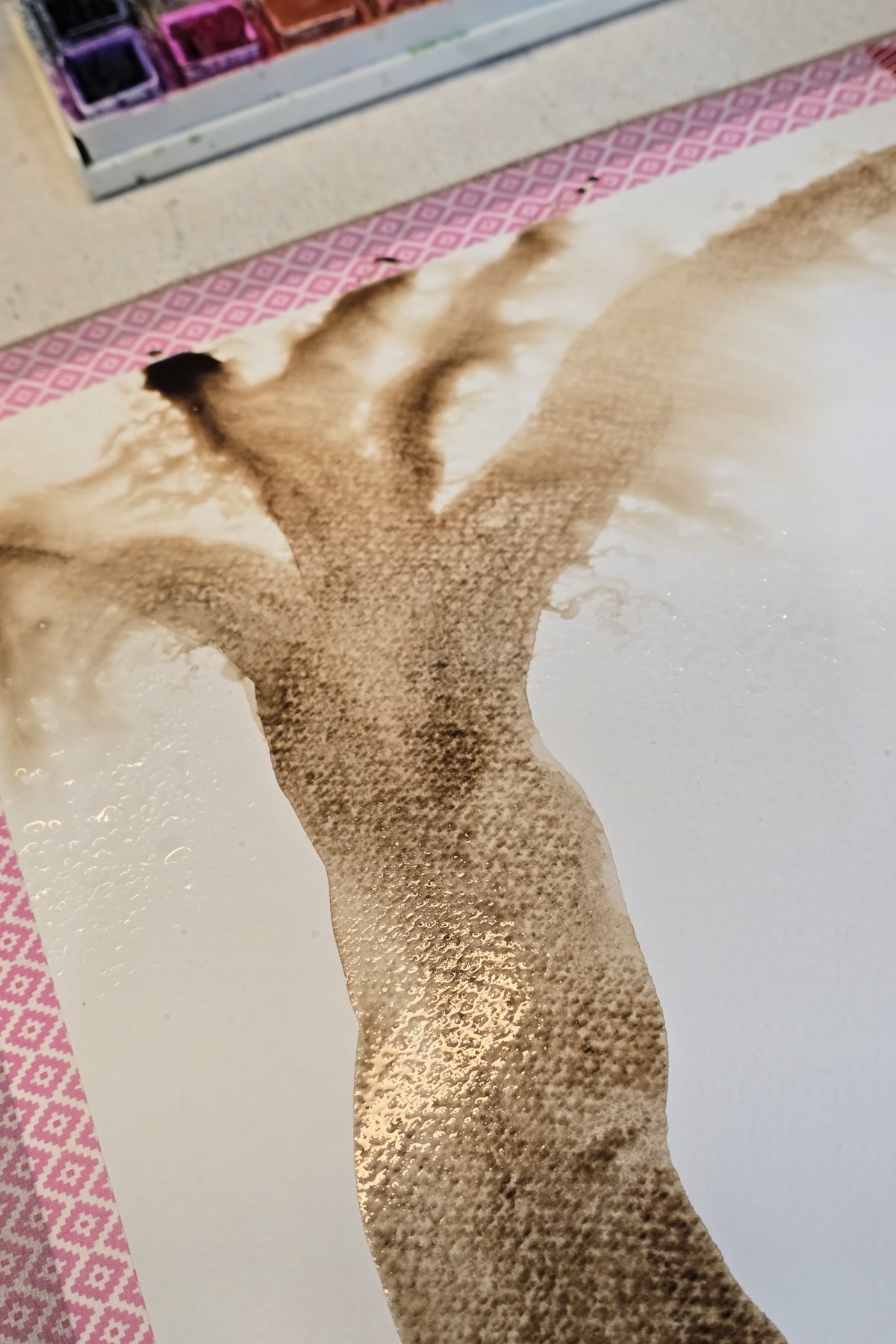 step 3 - spraying clean water onto wet watercolor branches - kids activities blog