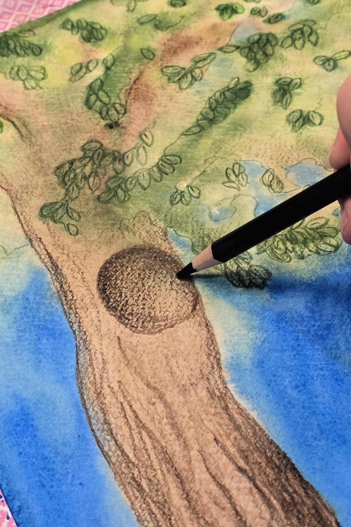 step 7 - completing tree project by adding details with a colored pencil - kids activities blog