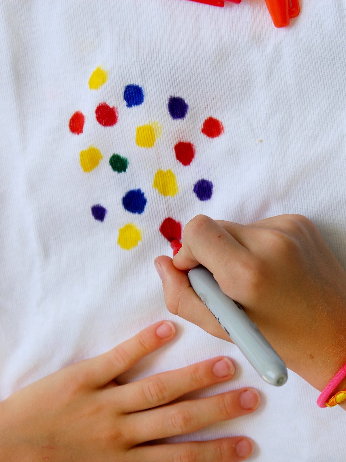 Tie Dye Science Experiment- Step 2- Polka dots, red, yellow, blue with permanent markers- kids activities blog