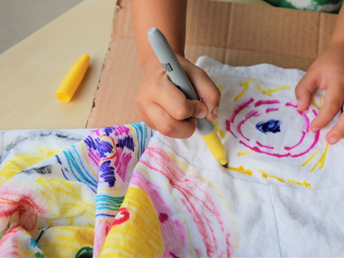 Tie Dye Science Experiment- Step 2.5- Draw pictures pink and yellow drawings on a shirt- kids activities blog