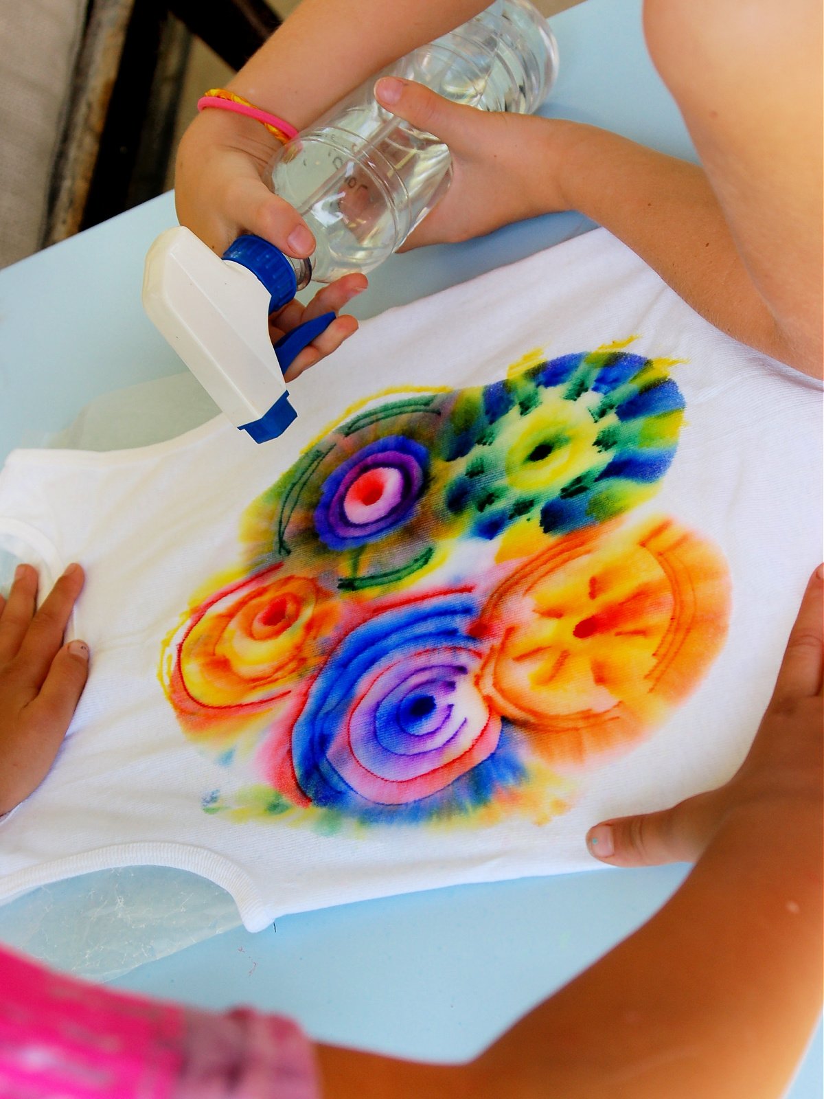 Tie Dye Science Experiment- Step 4- Spray alcohol on your shirt- kids activities blog