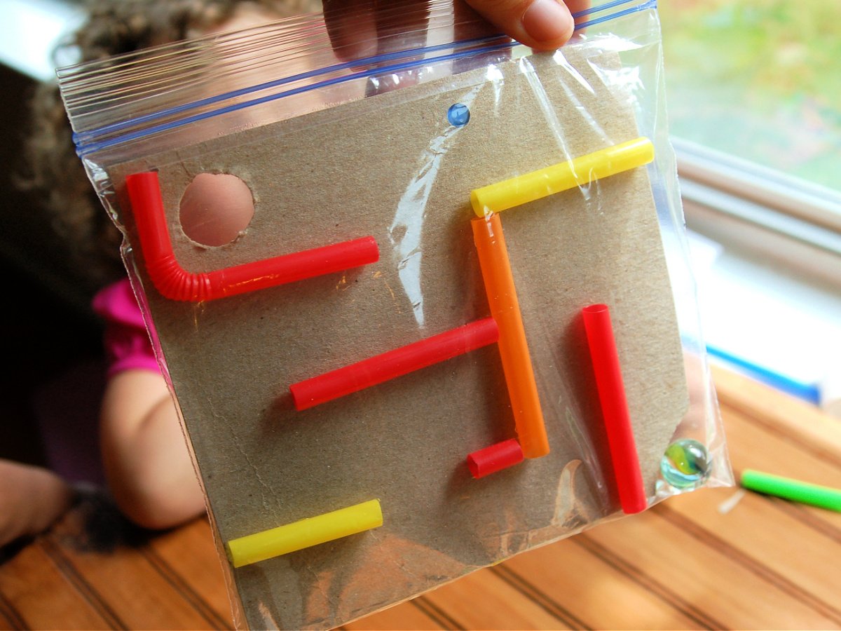 Maze Craft- Step 3 - Put your maze and marble into the plastic bag - Kids Activities Blog