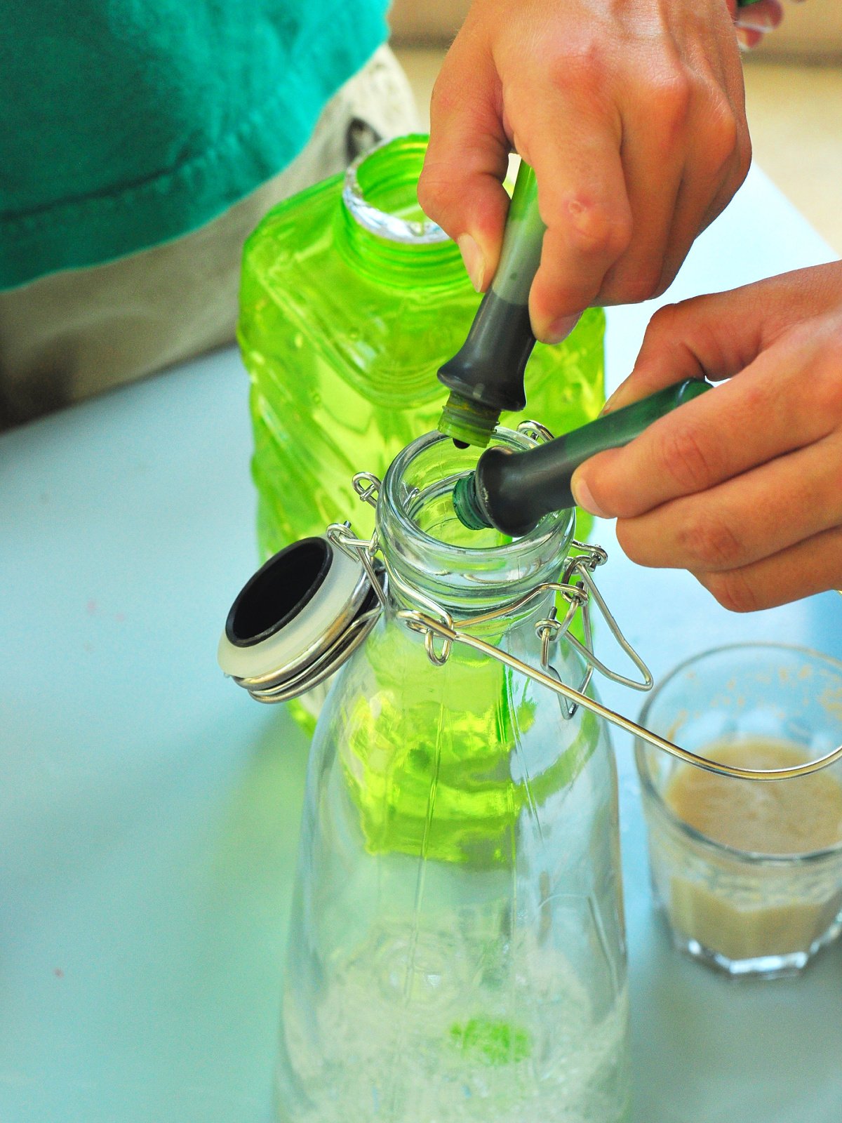 Elephant Toothpaste- step 2- add green food dye to bottle- kids activities blog