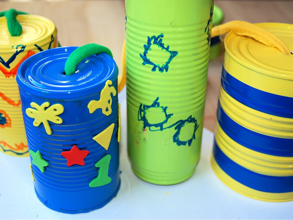 DIY Wind Chime Craft- Step 5- Tie the string through the cans- Kids Activities Blog