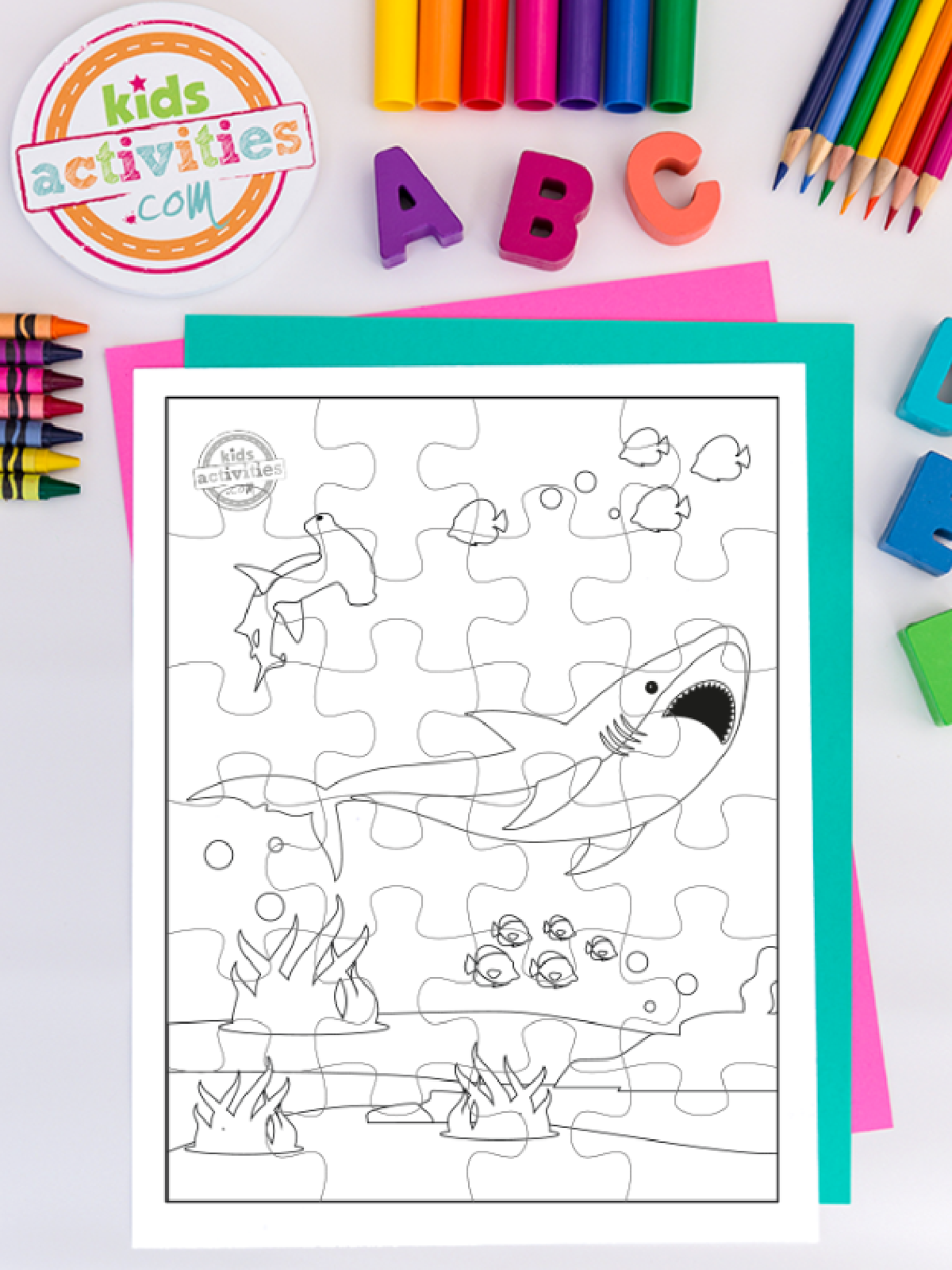 Shark Puzzles- Shark jigsaw puzzle black and white on a colorful background -Kids Activities Blog