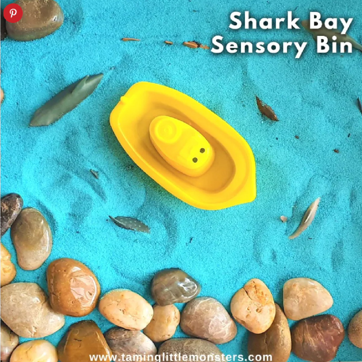 Shark Sensory Bin- Text with rocks, sand, and a boat- kids activities blog