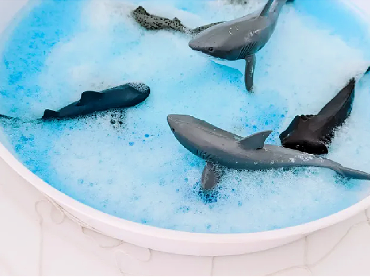 Shark Sensory Bin- sharks in blue foamy water- kids activities blog
