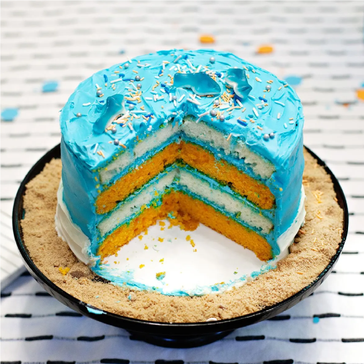 Shark food- shark cake that is blue with sprinkles and gummies- kids activities blog