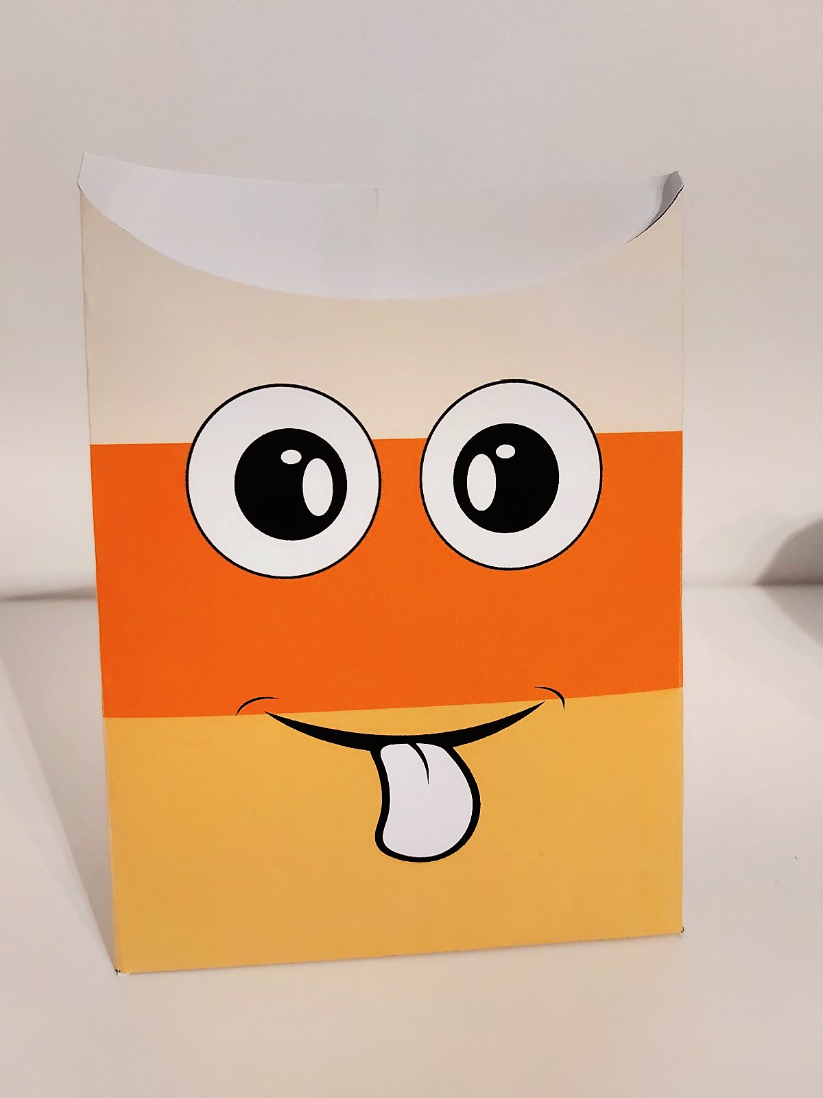 Halloween Treat Bag- Step 2 and 3- Glue sides and bottom together- kids activities blog