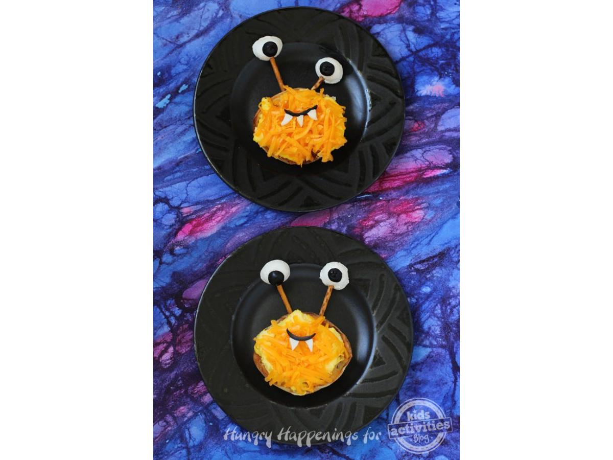 Halloween Recipes-food that looks like monsters with a black plate and blue pink and purple background -Kids Activities Blog