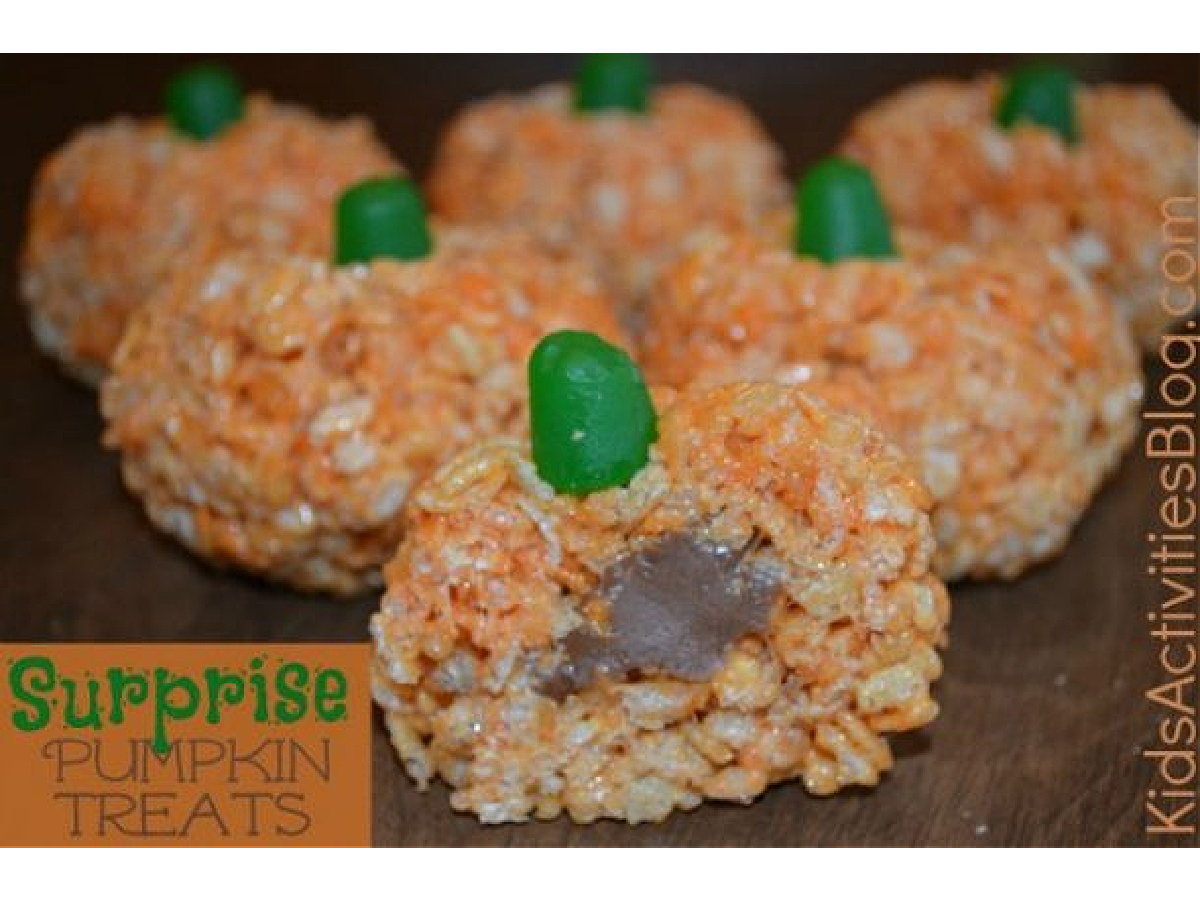 Halloween Recipes- rice crispy treats that look like pumpkins filled with tootsie rolls -Kids Activities Blog