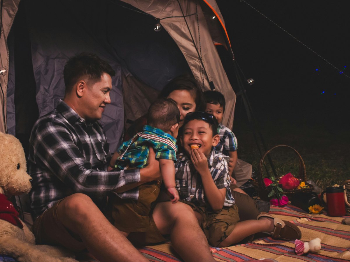 Halloween alternatives- family eating and picnicing outside at night- kids activities blog