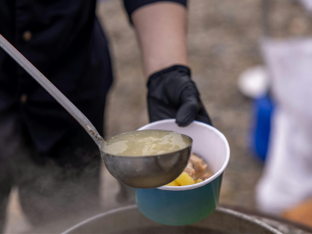 Halloween alternatives- person doling out soup in a bowl- kids activities blog
