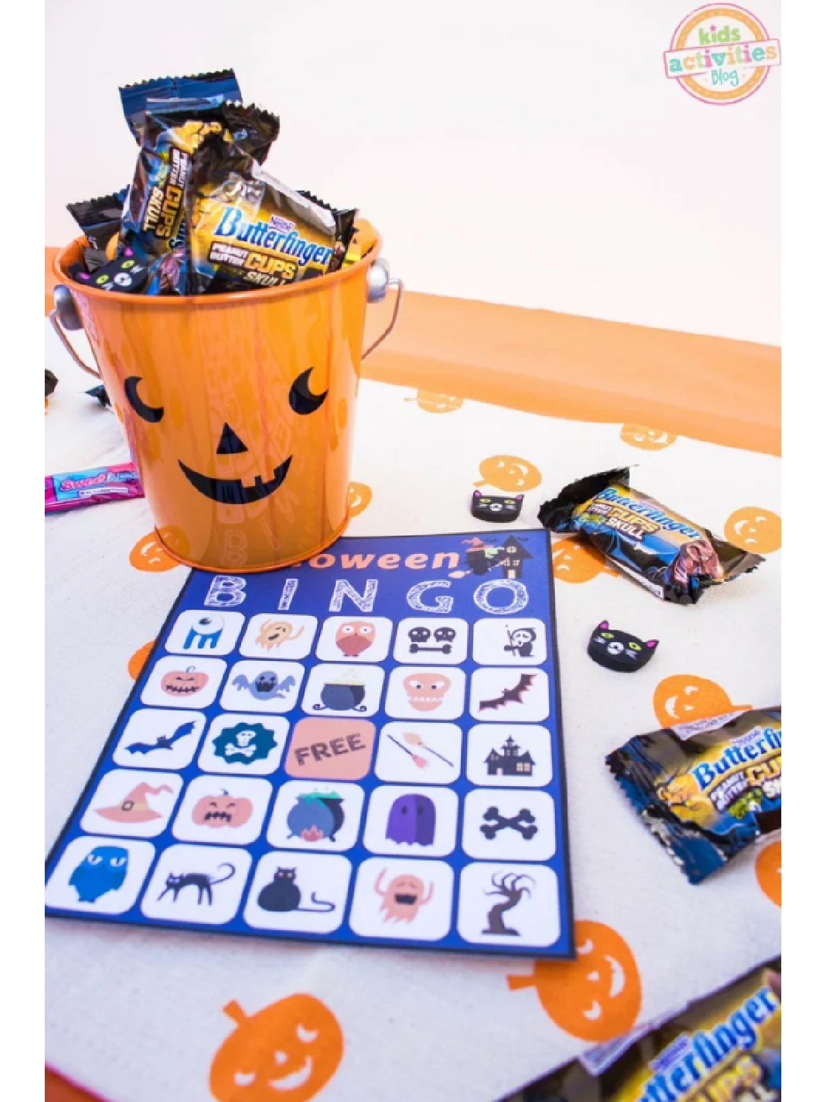 Halloween Puzzles- Bingo page colorful with candy around it- Kids Activities Blog