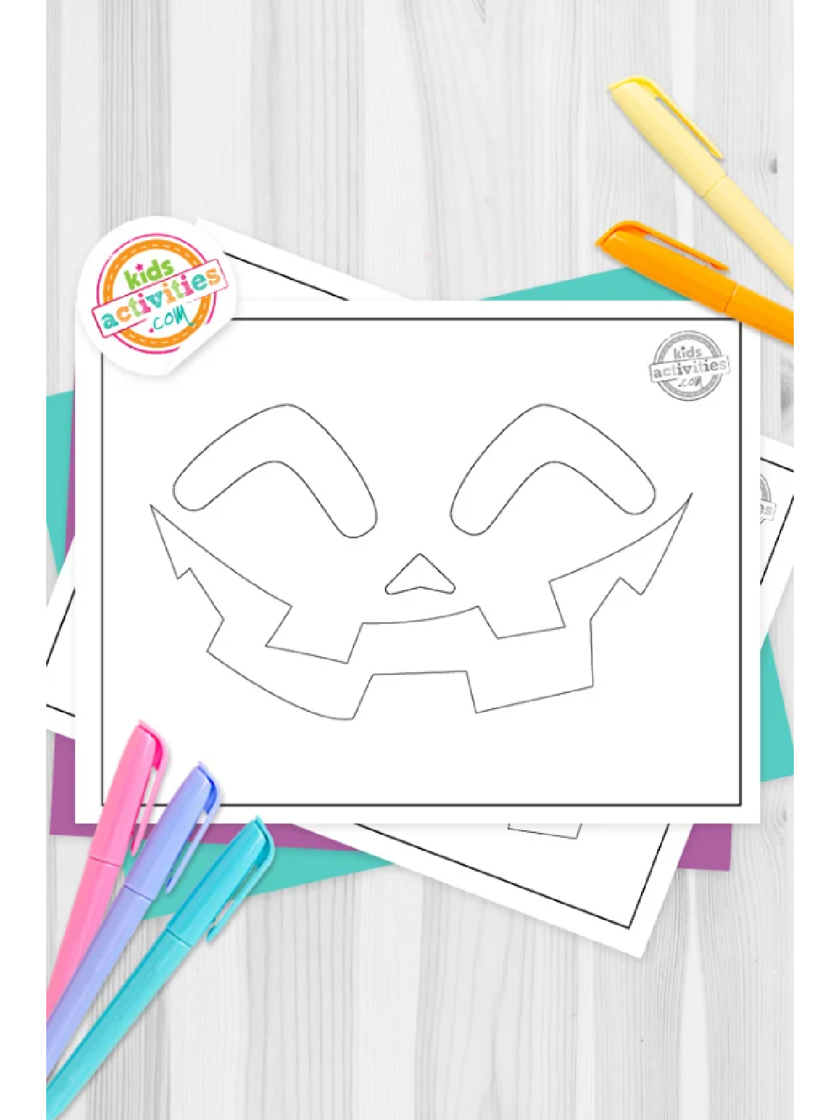 Halloween Pumpkin Carving Template- classic jack o lantern template against coloring supplies - Kids Activities Blog