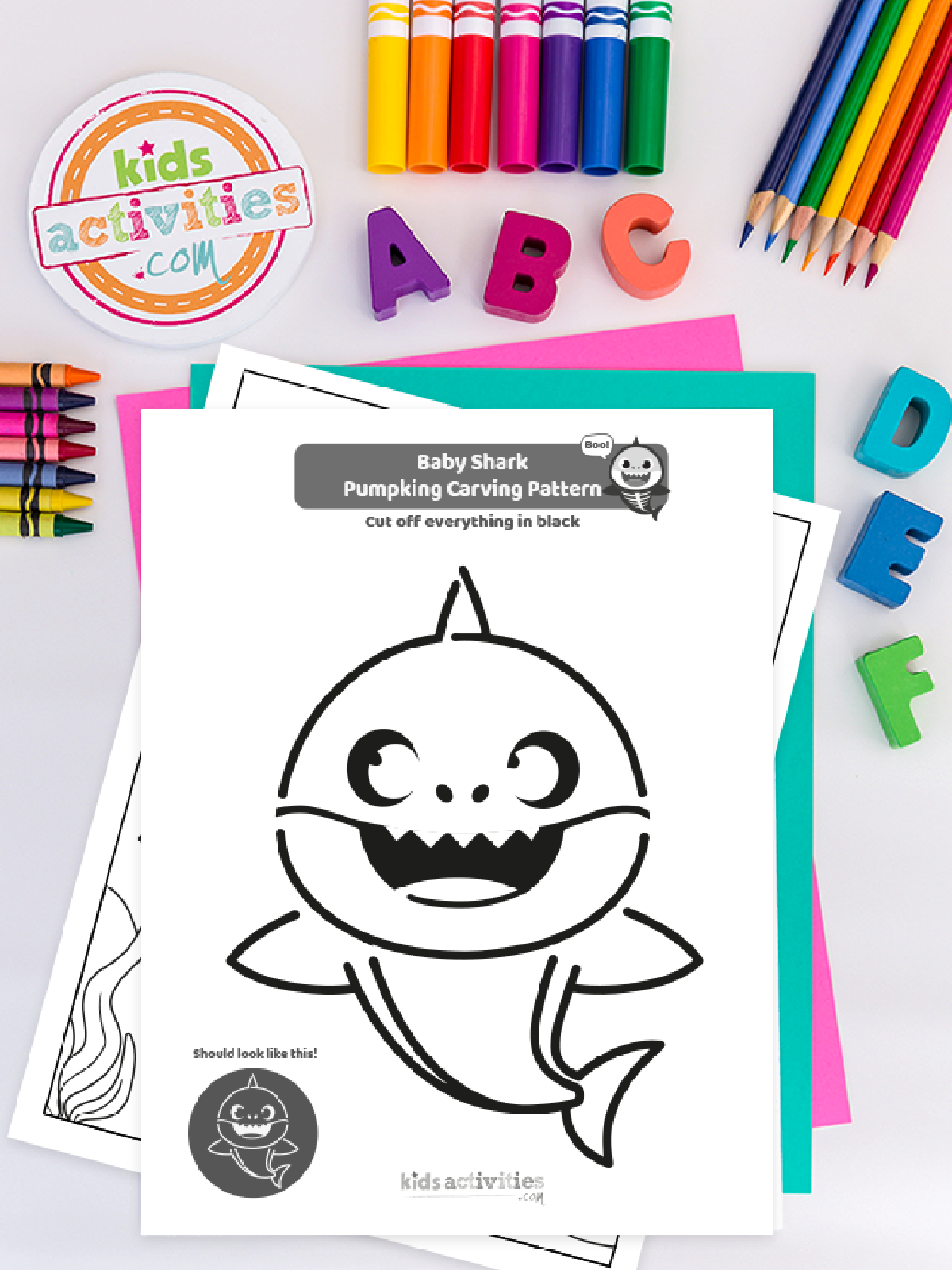 Halloween Pumpkin Carving Template- baby shark template on a colorful background- Kids Activities Blog