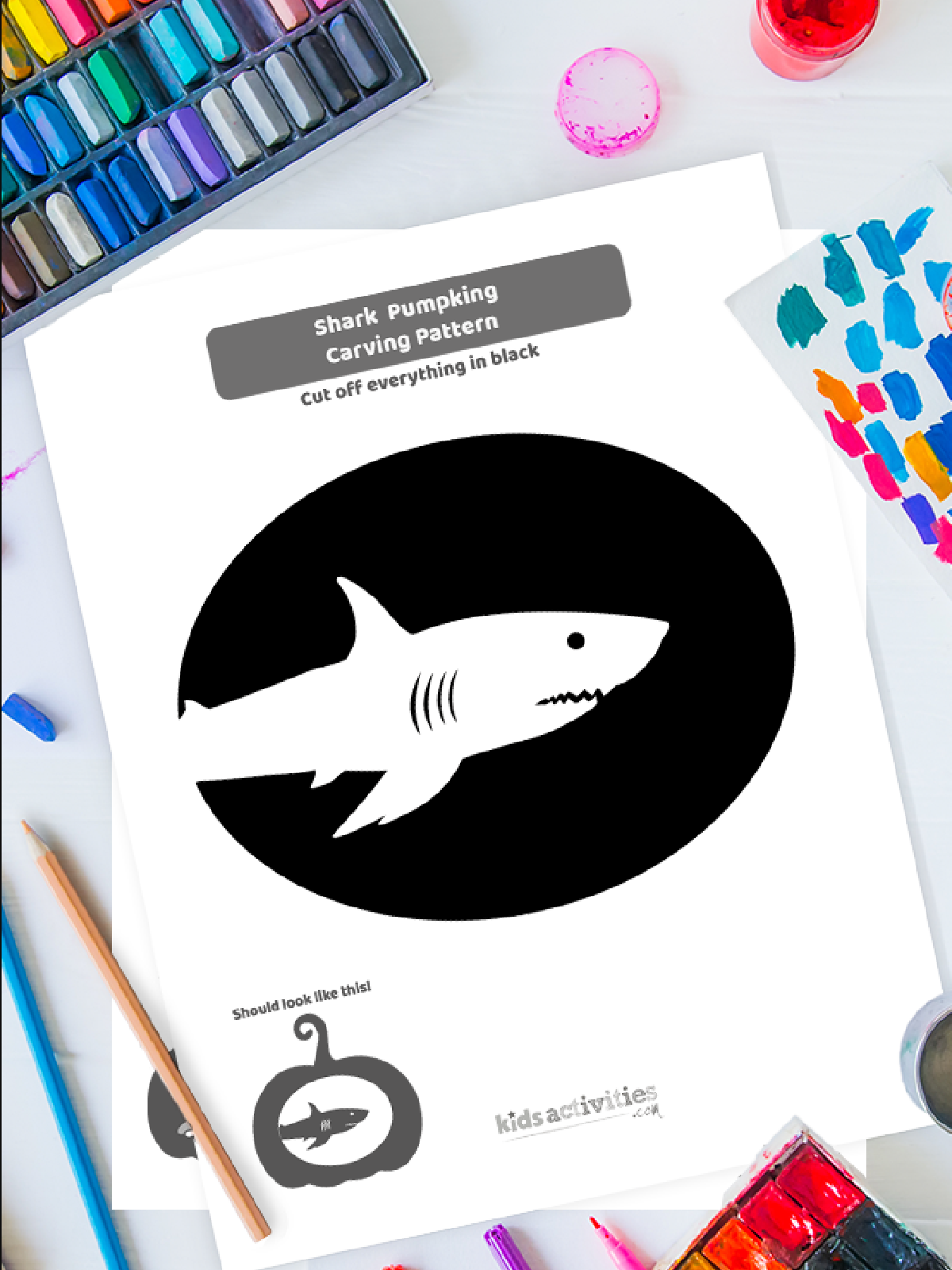 Halloween Pumpkin Carving Template- shark template on a colorful background with accessories - Kids Activities Blog